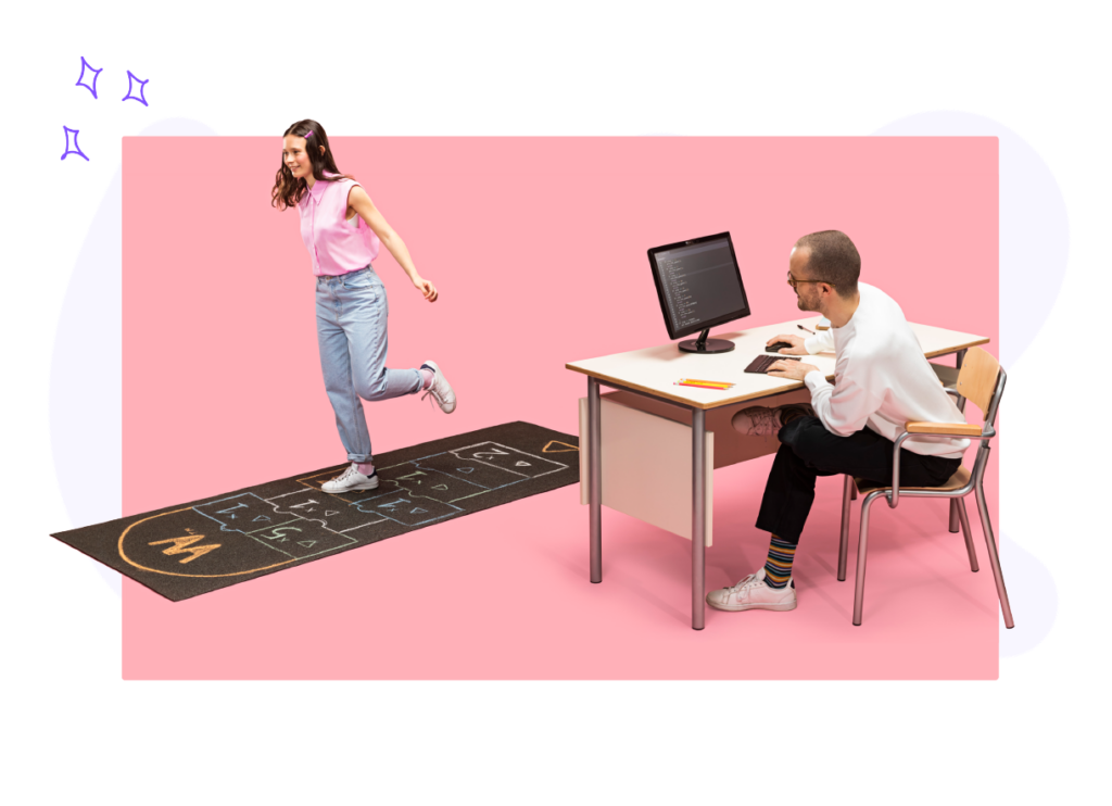 A student playing Hopscotch happily while a male teacher stares at her enthusiastically behind a desk while typing on a computer keyboard