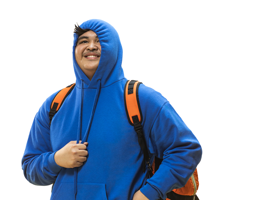 A boy with an orange backpack and a blue hoodie that looks forward happily